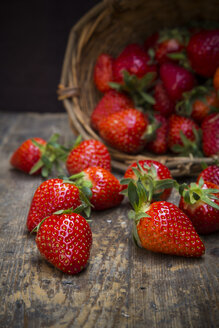 Basket of strawberries on dark wood - LVF001262