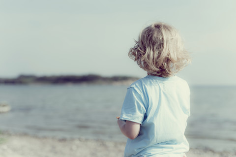 Germany, Mecklenburg-Western Pomerania, Ruegen, Boy at the ocean stock photo