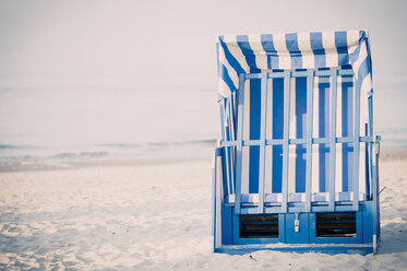 Germany, Mecklenburg-Western Pomerania, Ruegen, Closed beach chair on beach - MJF001181