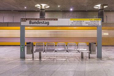 Germany, Berlin, modern architecture of subway station Bundestag with moving underground train - NKF000118