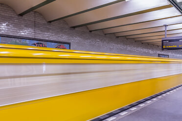 Germany, Berlin, subway station Deutsche Oper with moving underground train - NKF000123