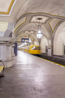 Germany, Berlin, historic subway station Heidelberger Platz with moving underground train - NKF000135