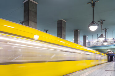 Germany, Berlin, subway station Lindauer Allee with moving underground train - NKF000139