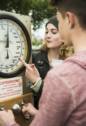 Teenage couple at fun fair stock photo