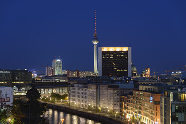 Germany, Berlin, Friedrichstrasse and TV tower at night - HHEF000097