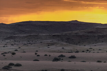 Africa, Namibia, Damaraland, view to grassland and volcanos by sunset - HLF000605