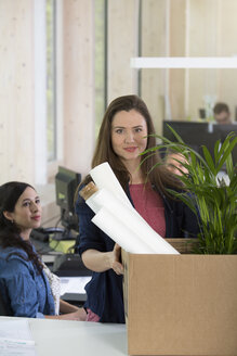 Portrait of business woman at her first day in office - FKF000556