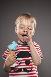 Portrait of little boy with painted beard and ice cream - OJF000030