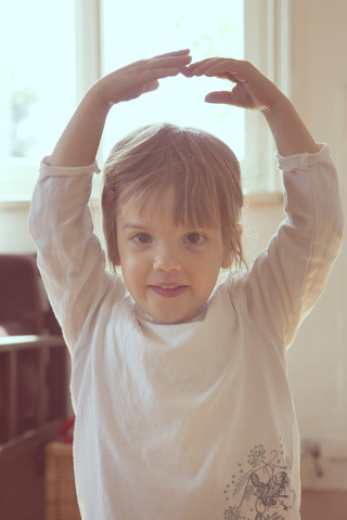 Portrait of little girl dancing stock photo