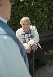 Portrait of happy old man witk walking stick - UUF000688