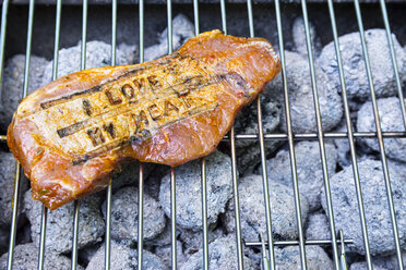 Pork steak with branding on barbecue grill - ONF000593