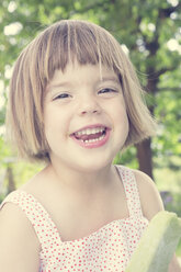 Portrait of laughing little girl with ice lolly - LVF001372