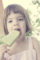 Portrait of little girl eating ice lolly - LVF001355