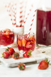 Glass of iced red fruit tea with strawberries and crushed ice - SBDF000977