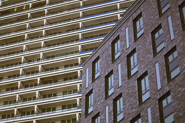 Germany, Berlin, Brick stone building in front of High-rise residential building - ZMF000288