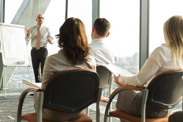 Group of businesspeople attending a seminar - WESTF019349