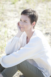 Portrait of woman in front of sand dune - MAEF008394