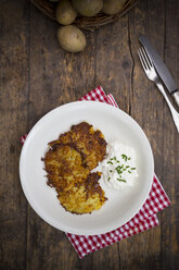 Potato fritters with quark and chives on plate - LVF001399