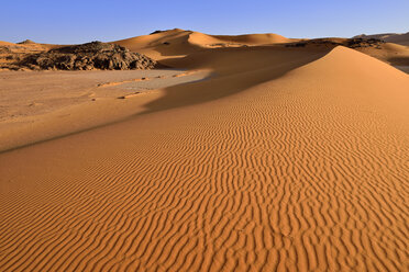 Africa, Algeria, Sahara, Tassili N'Ajjer National Park, Tadrart, Rocks and sand dunes at Oued in Djerane - ES001203