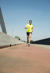 Man jogging on bridge - UUF000933
