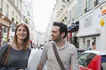 France, Paris, portrait of happy couple having fun - FMKF001250