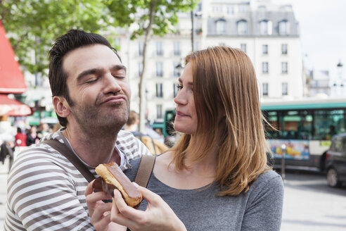 France, Paris, portrait of happy couple having fun - FMKF001251