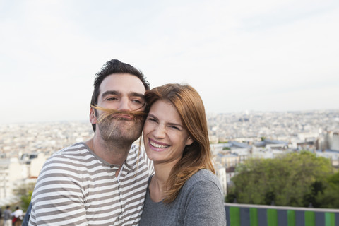 France, Paris, portrait of happy couple having fun stock photo
