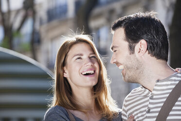 France, Paris, portrait of happy couple having fun - FMKF001344