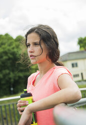 Portrait of young woman with drinking bottle - UUF000955