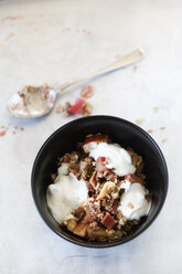 Rhubarb Strawberry Crumble with yogurt in a bowl, spoon - EVGF000618