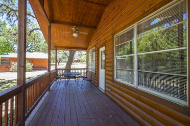 USA, Texas, Porch of log home cabin - ABAF001362