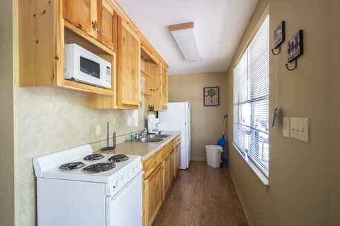 USA, Texas, Galley Kitchen Interior in Vacation Cabin - ABAF001363