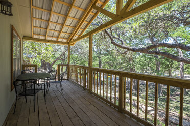 USA, Texas, Porch of log home cabin - ABAF001368