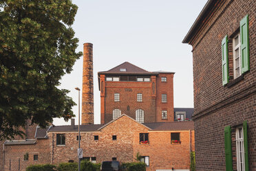 Germany, Cologne Widdersdorf, historic fabric formerly brewery converted to residential house - GWF003561