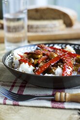 Sweet and sour eggplant with red Pepper on rice and garnished with sesame seeds - HAWF000338