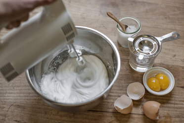 Beating egg white with electric whisk, elevated view - IPF000144