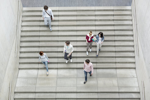 Group of students walking on stairs - WESTF019699