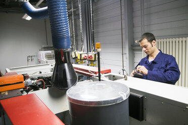 Technician working in a technical room - SGF000801