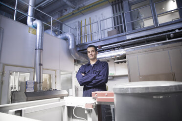 Portrait of confident technician in a technical room - SGF000803