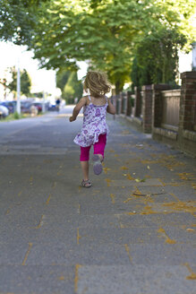 Little girl running on walkway - JFEF000418