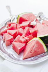 Plate of pieces of watermelon and two forks - CZF000156
