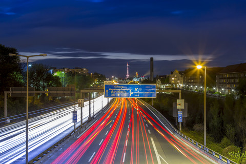 Germany, Berlin, Berlin-Charlottenburg, Federal Motorway 100 through downtown Berlin with the Funkturm Berlin in the background at night stock photo