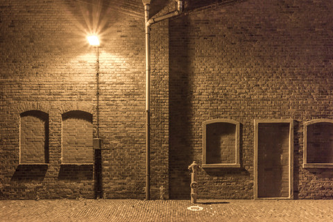 Germany, Bremen, A hydrant and a street lamp in an abandoned industrial district stock photo