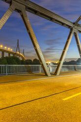 Germany, Hamburg, The Koehlbrand Bridge seen through a frame bridge in the port of hamburg - NKF000163