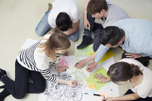 Group of creative professionals working on floor - STKF001006