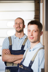 Portrait of two craftsmen on shop floor - FKCF000047