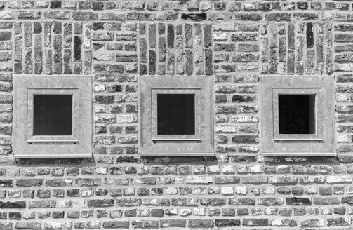 Germany, North Rhine-Westphalia, Grevenbroich, part of brick facade with three windows - HLF000626