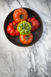 Marinda tomatoes in bol on marble plate - LVF001509