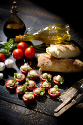 Slices of mozzarella cheese, tomatoes and basil herb - MAEF008681