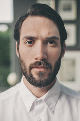 Portrait of young bearded man wearing white shirt - MFF001151